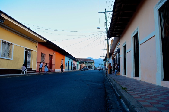 The streets are lively and colorful at 5:00 on this weekday in Granada. Volcán Mombacho looms in the background.